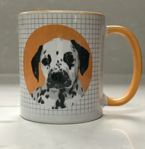 Mug with spot icon of dog on a check background with coloured handles