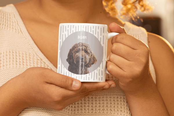 custom pet portrait mug being held by a lady